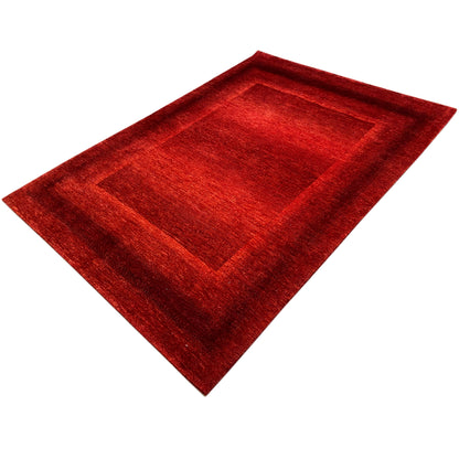 Red carpet with a square center section and border, positioned diagonally