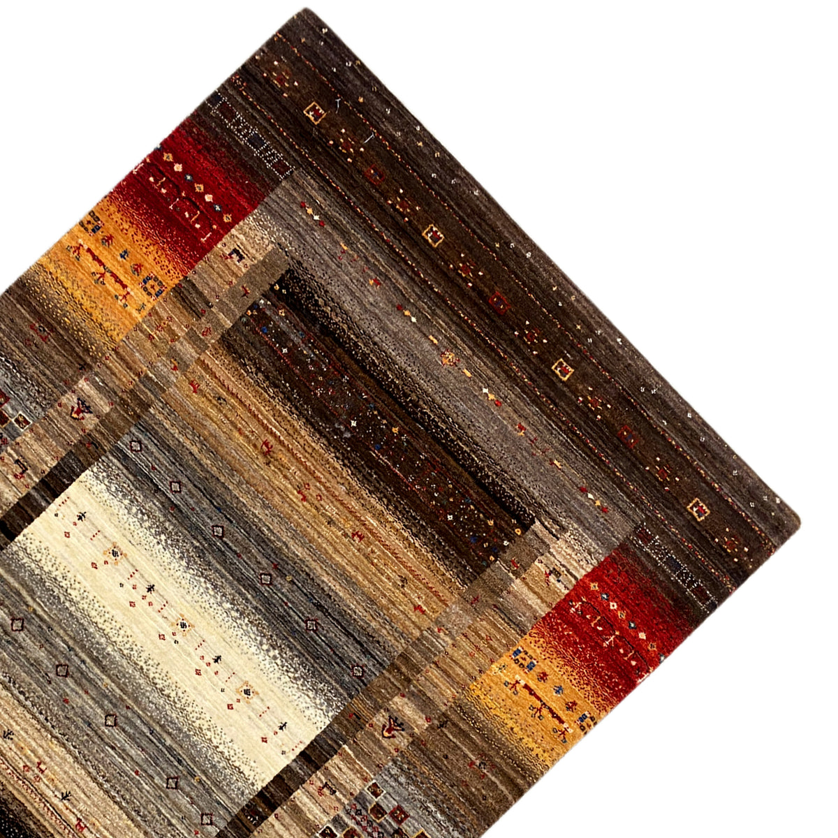 Carpet detail with an aged-looking pile, shades of brown, and red and yellow stripes