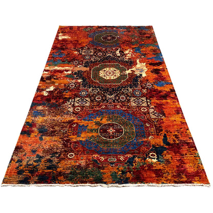 Hand-knotted Mamluk rug with borders, red-orange, blue, and gold tones, laid flat