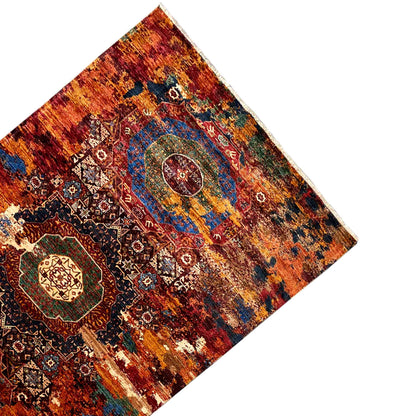 Hand-knotted Mamluk rug, corner view with border and pattern in red-orange and blue