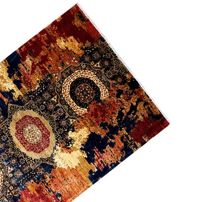 Mamluk wool rug, top view of the corner: red, blue, and beige pattern with border