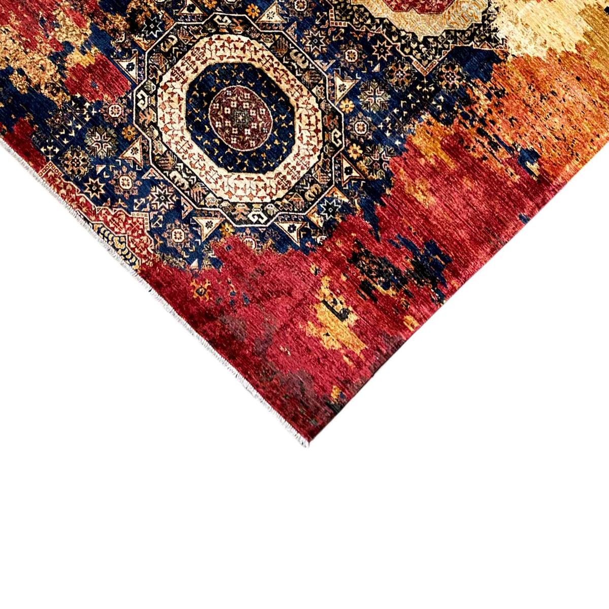Mamluk wool rug corner detail, red ornamental medallion, bordered edge