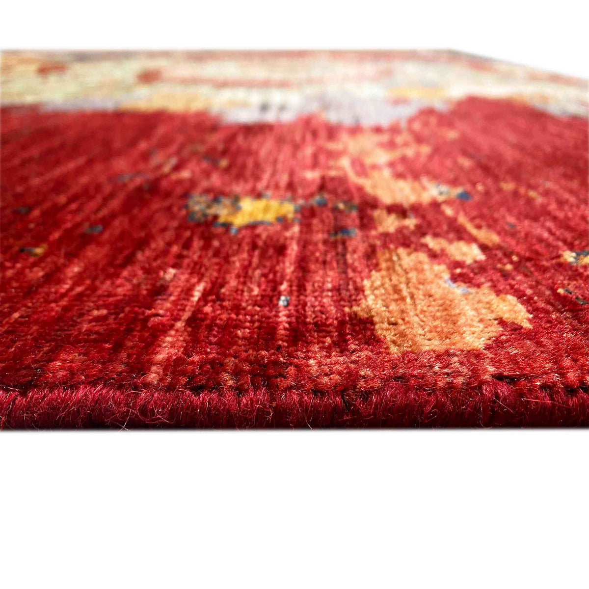 Hand-knotted Mamluk rug, close-up: red pile surface with faded-looking ornaments
