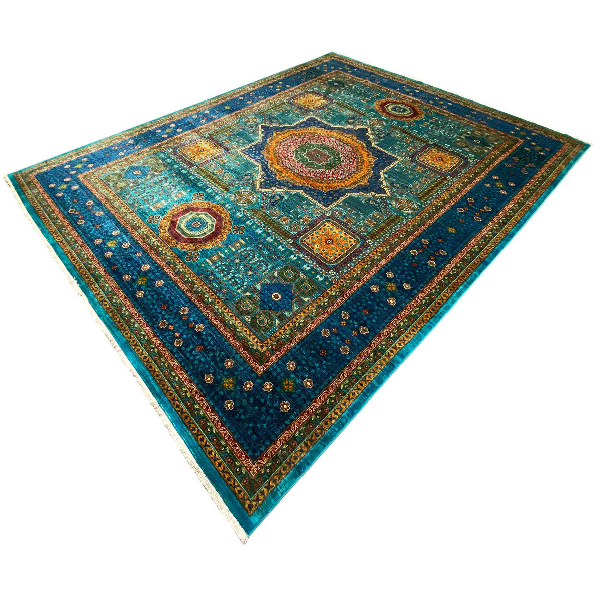 Blue rug with patchwork-style ornaments and a star-shaped medallion