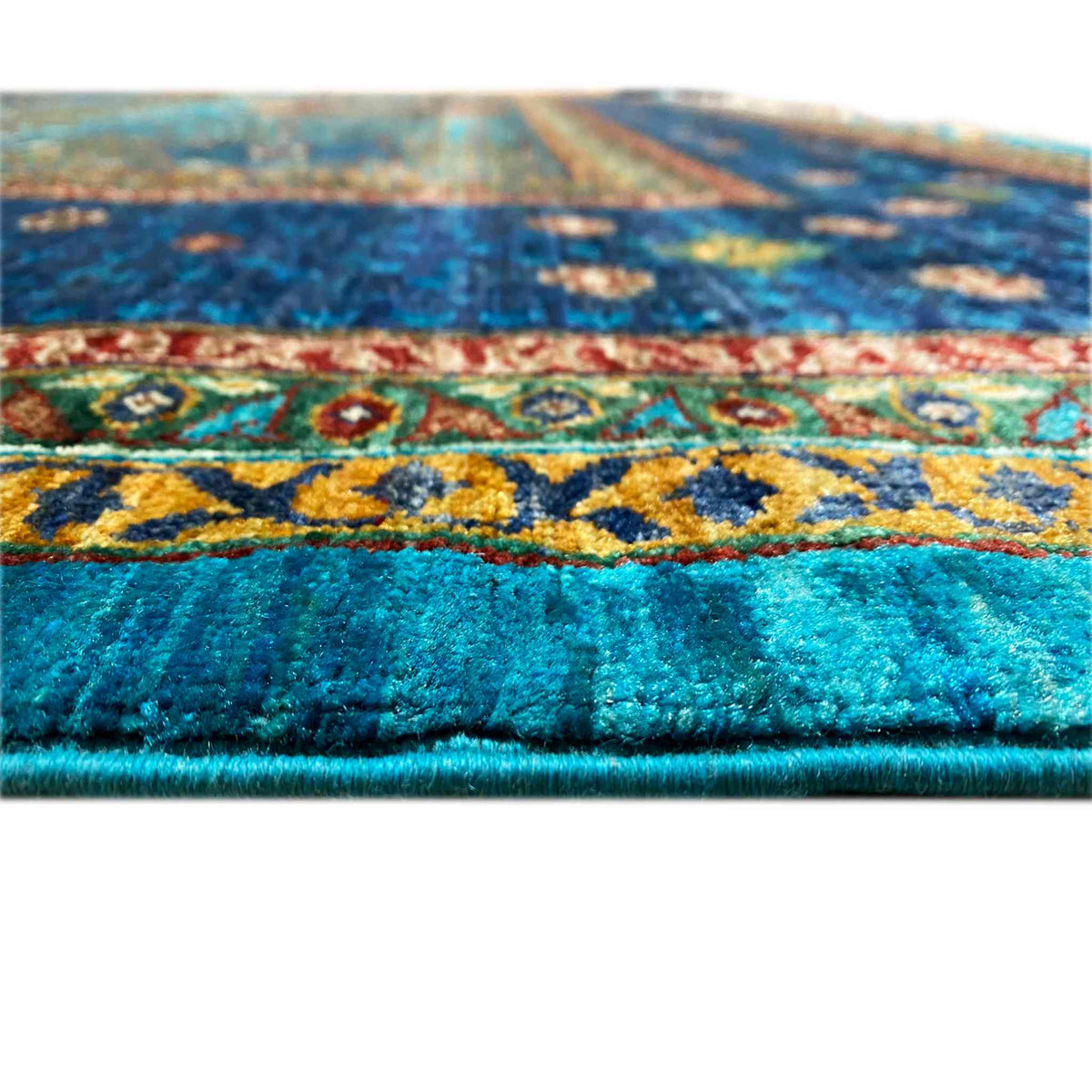 Blue carpet with a dense pile and multicolored ornaments along the border