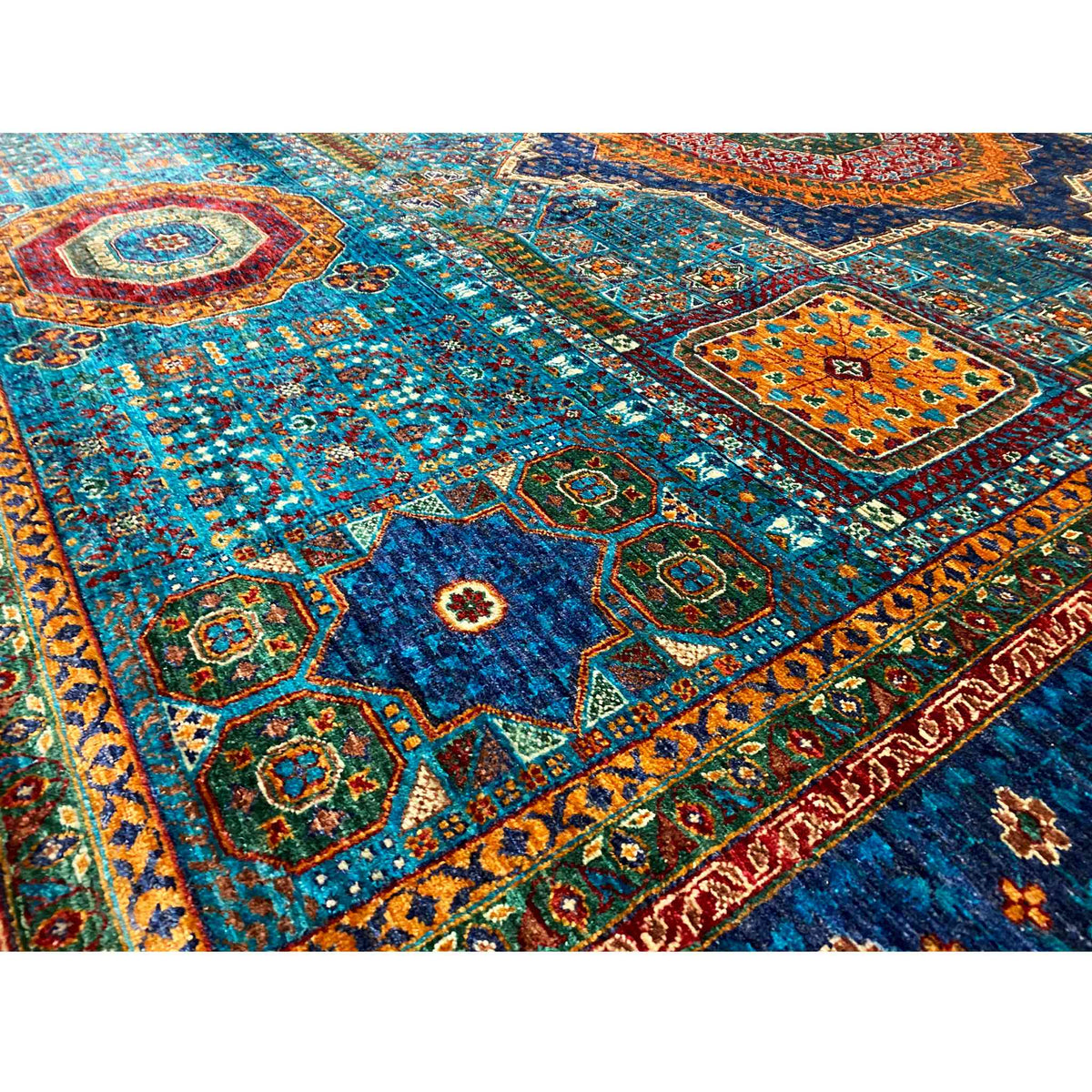 Blue carpet detail with fine diamonds, mini medallions, and colorful accents
