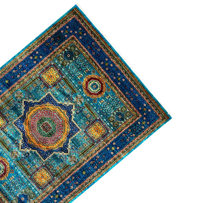 Blue carpet with a blue-and-yellow border, floral circular motifs, and corner patterns