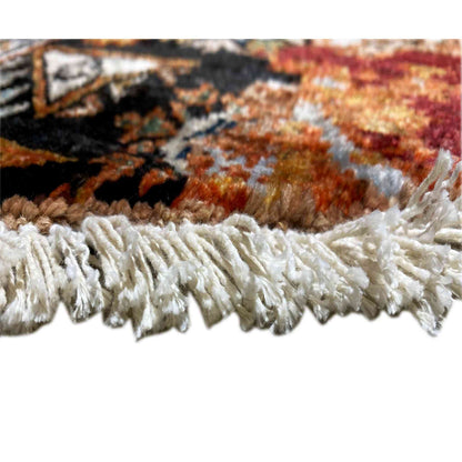 Rug fringe along the edge, fluffy white-cream fibers over a brown background