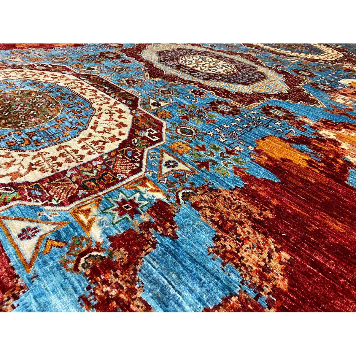 Close-up: geometric ornaments and medallions in blue, red, and turquoise