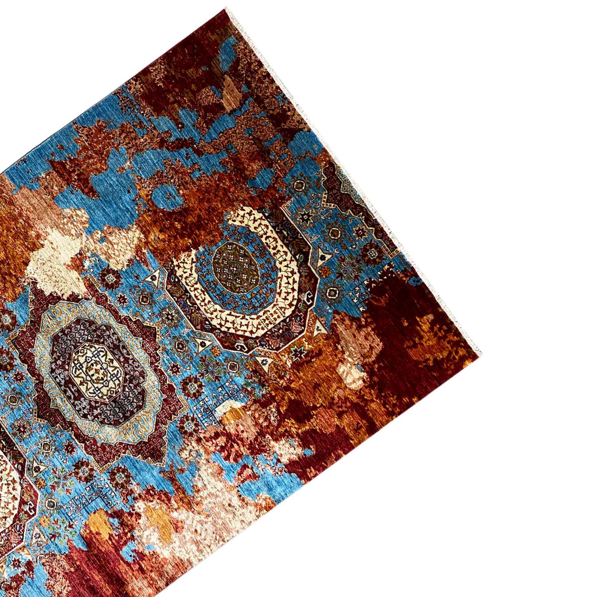 Rug viewed from an angled perspective with an oriental pattern in blue and red