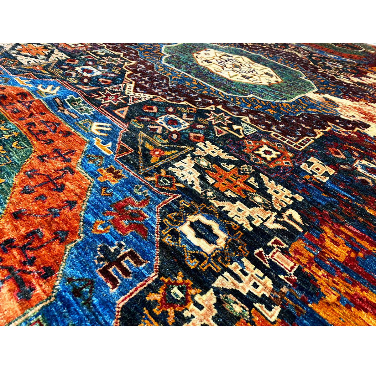 Afghan Mamluk rug, close-up: geometric ornaments in blue, orange, and dark brown