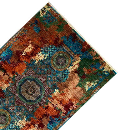 Mamluk carpet corner in oblique view, medallions in rust brown and teal, with border