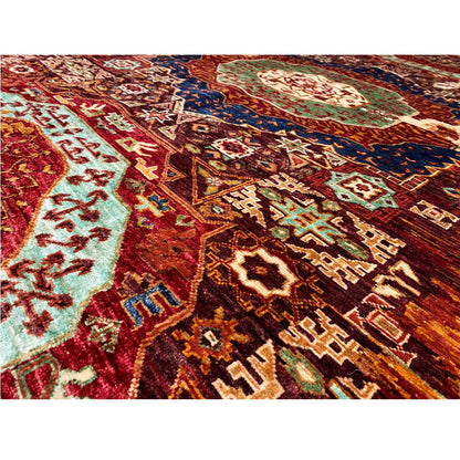 Close-up of the patterns on a Mamluk rug: rust brown with blue-green and cream motifs