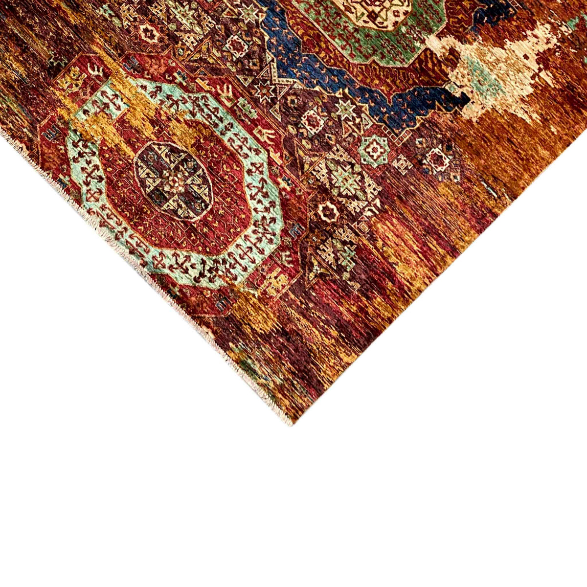 Mamluk rug corner view with rust-brown ornaments, blue border, and cream-colored details