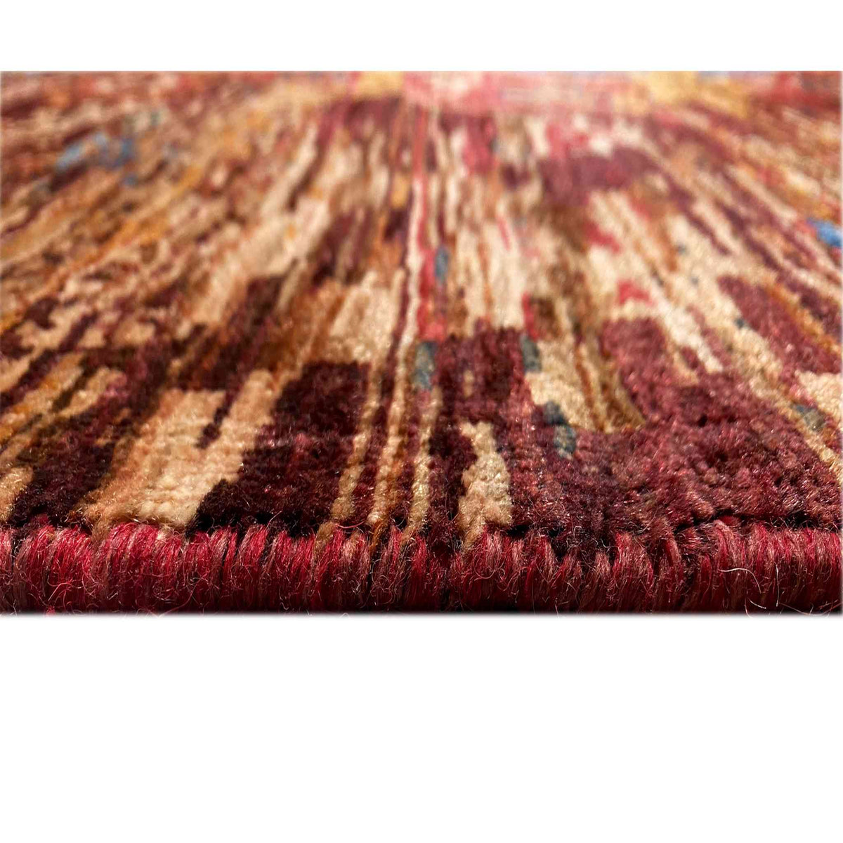 Close-up of a Mamluk rug: pile surface, rust and dark red tones with a shimmering texture