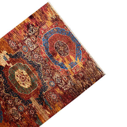 Mamluk carpet, top view, rust-brown with a blue medallion and surrounding patterns
