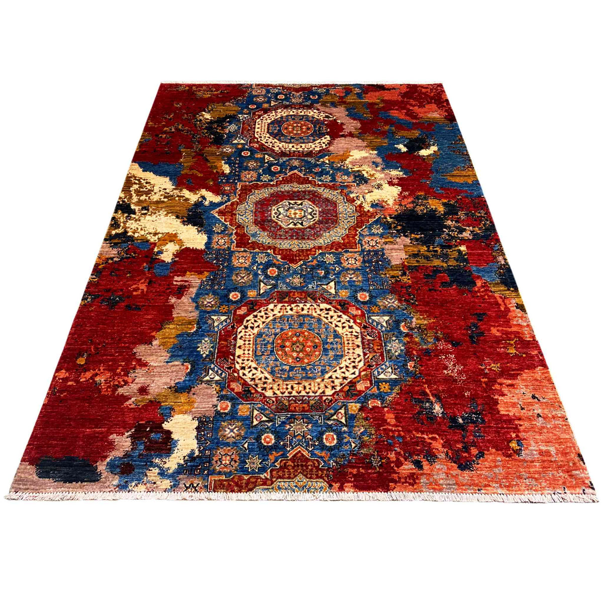 Rectangular rug with a red background, blue ornamental fields, and beige accents