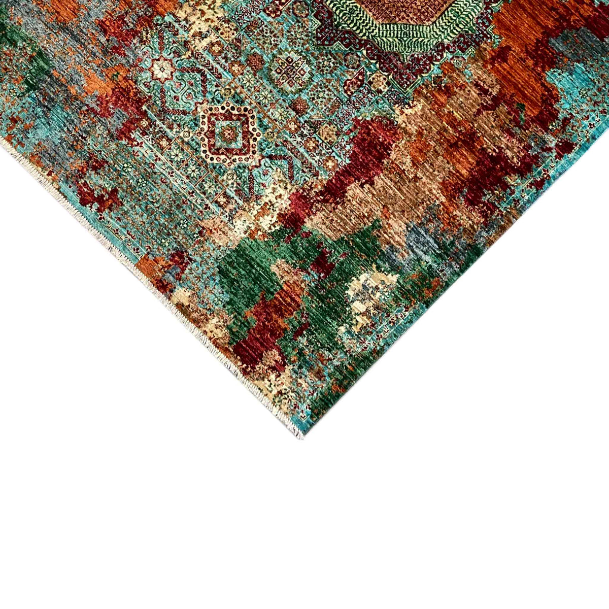 Detail of the corner of a Mamluk carpet with a woven border, turquoise multicolored ornamental pattern