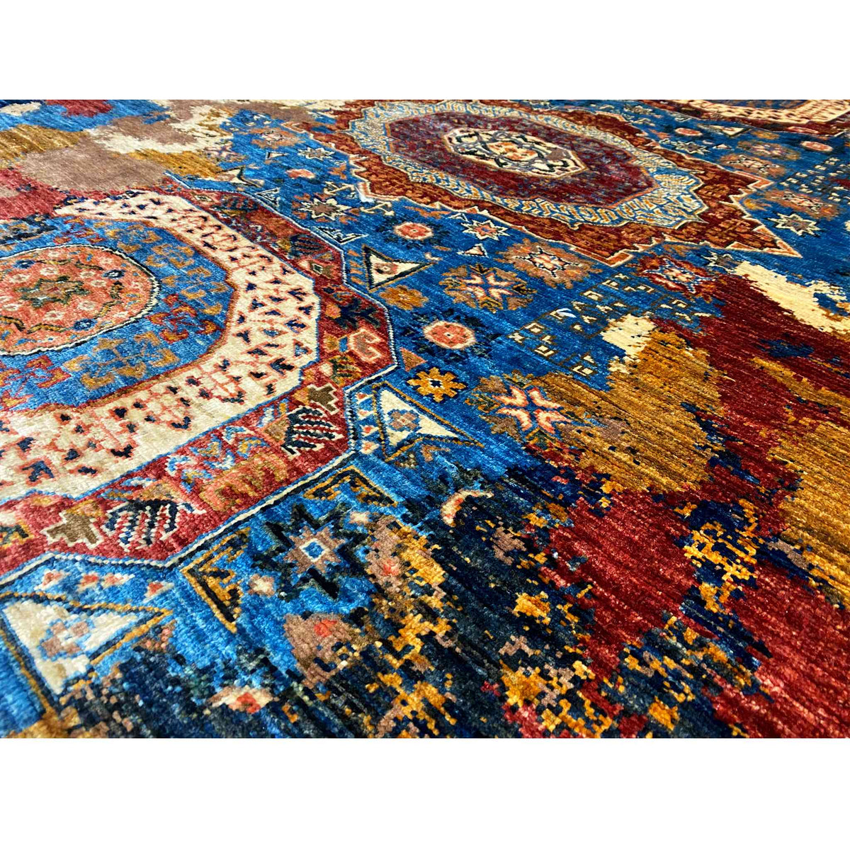 Carpet detail with ornaments, star and cross motifs, blue ground, red and gold