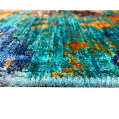 Mamluk rug detail: turquoise-brown pattern with fringes along the edge