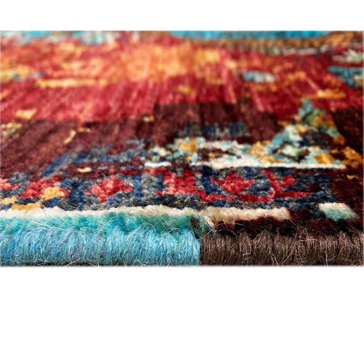 Detail: Multicolored runner rug with fringes, rug edge, and textured pile