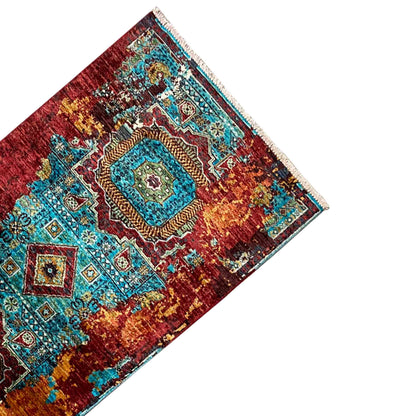 Runner rug diagonal: central medallions in turquoise and red, multicolored border edging