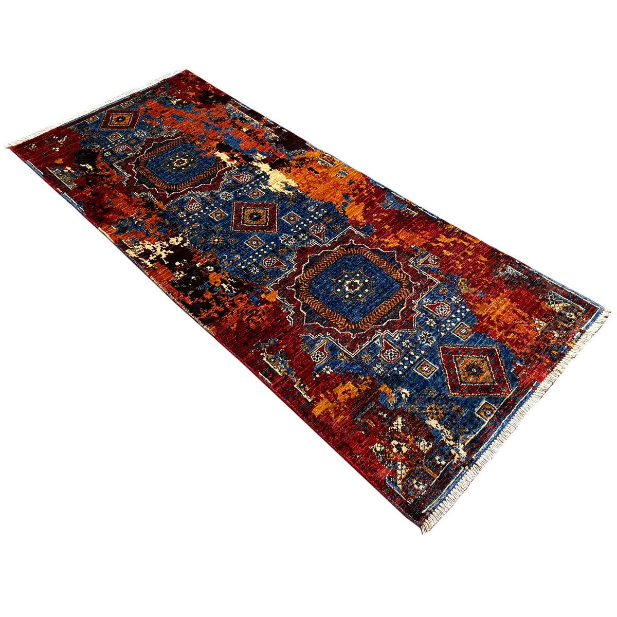 Mamluk runner rug, photographed diagonally: geometric pattern in red, blue, yellow