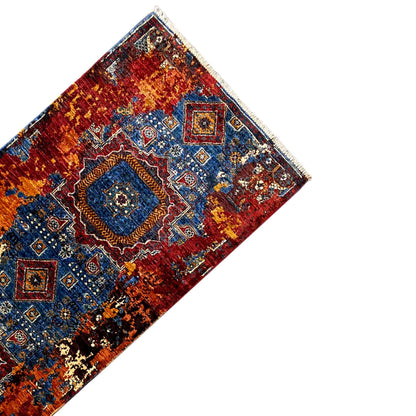 Mamluk runner rug with geometric border motifs, red and blue accents, fringes