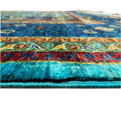 Hand-knotted Mamluk carpet: side view of the pile with a multicolored pattern at the edge