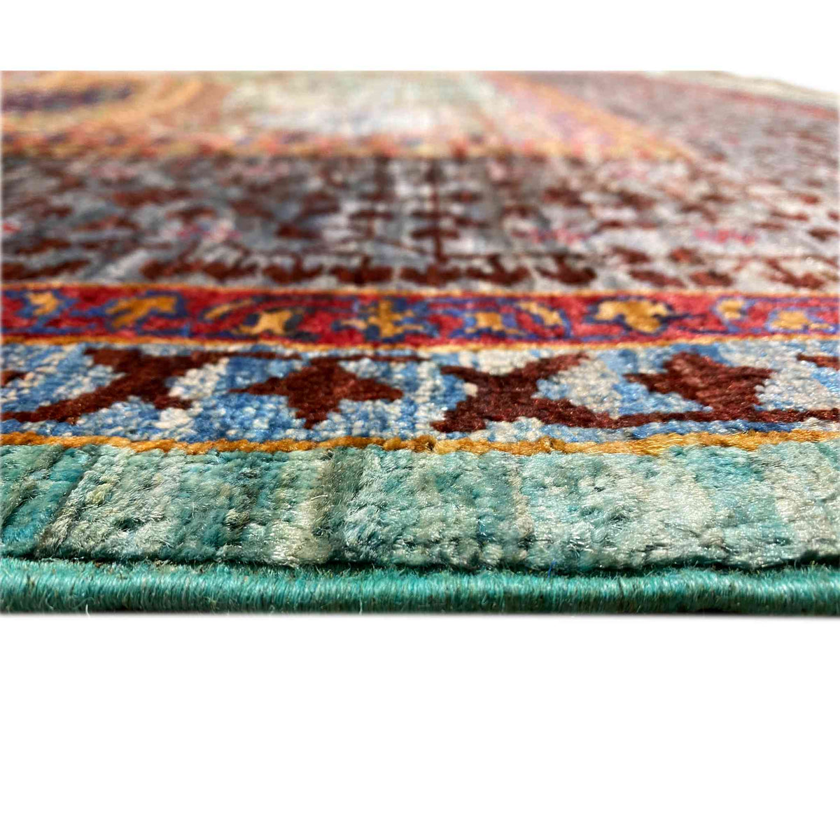 Hand-knotted Mamluk rug edge with dense pile and turquoise border