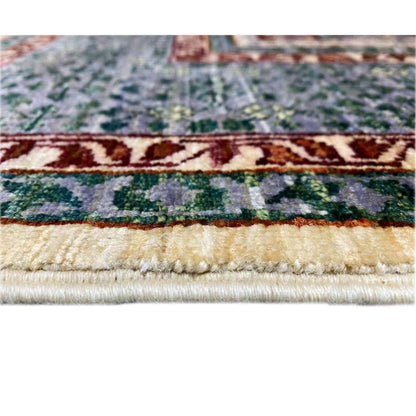 Rug edge with fringe and a stepped pattern in gray, green, and red