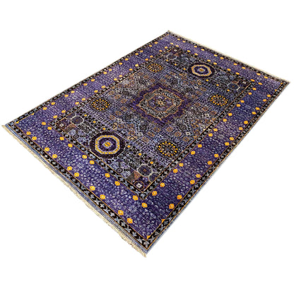 Rug with a central medallion and surrounding borders in blue and yellow