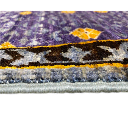 Rug edge with short pile and fringe, blue-purple with a yellow accent stripe