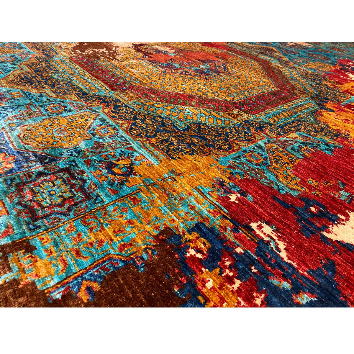 Hand-knotted Mamluk carpet detail: woven ornaments in blue, turquoise, red and gold
