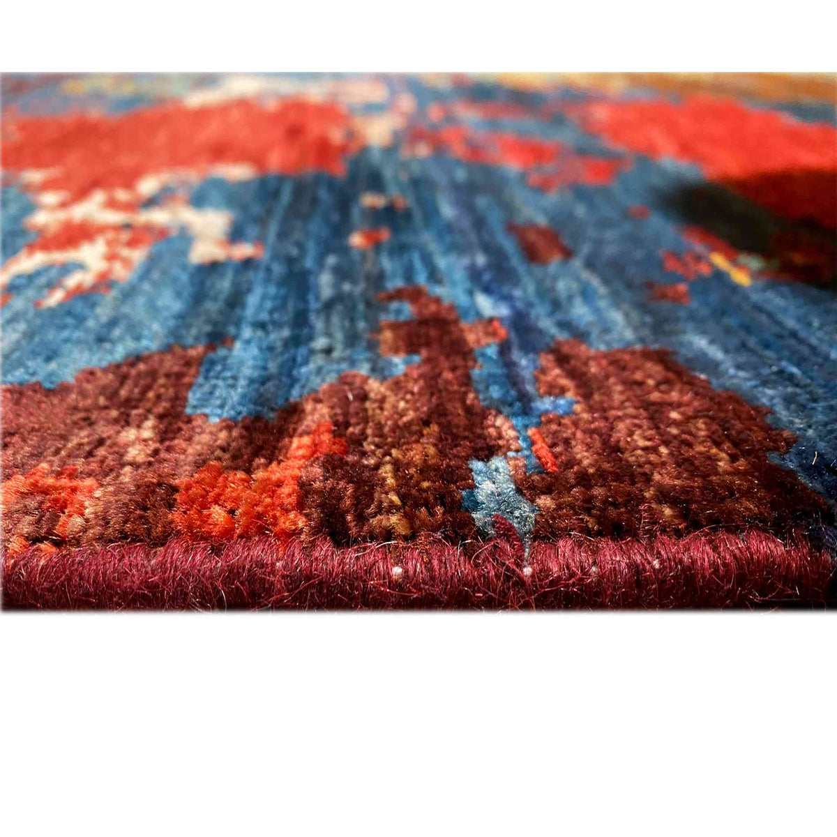 Hand-knotted Mamluk rug, close-up of the pile, red and blue tones, dense woven textile