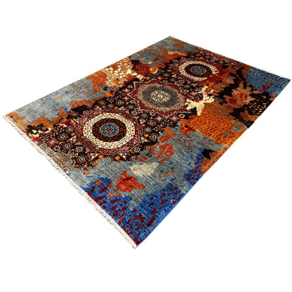 Hand-knotted Mamluk rug laid at an angle, geometric ornaments and patches of brown/blue color