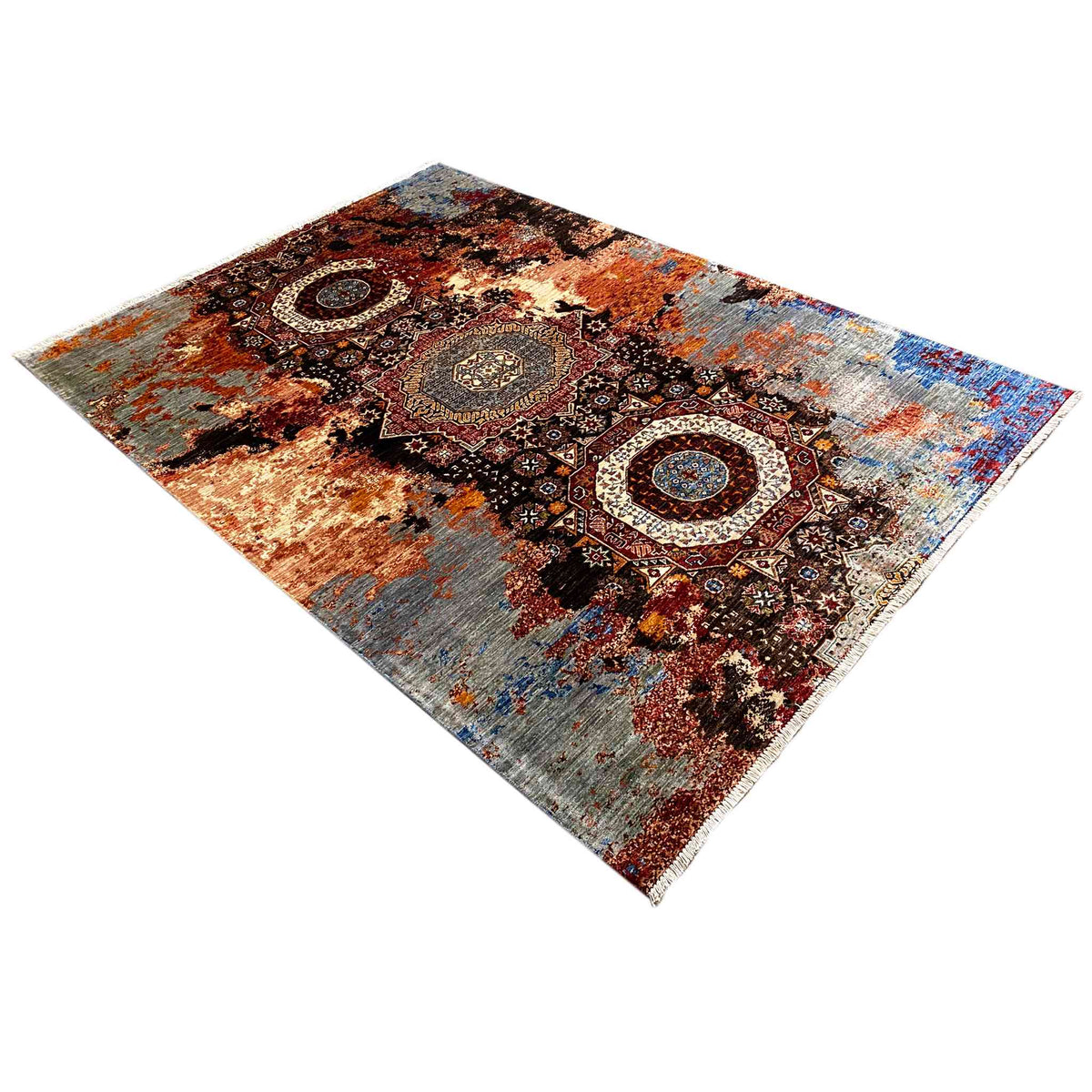 Mamluk rug viewed at an angle with ornaments in black, rust brown, blue, and cream
