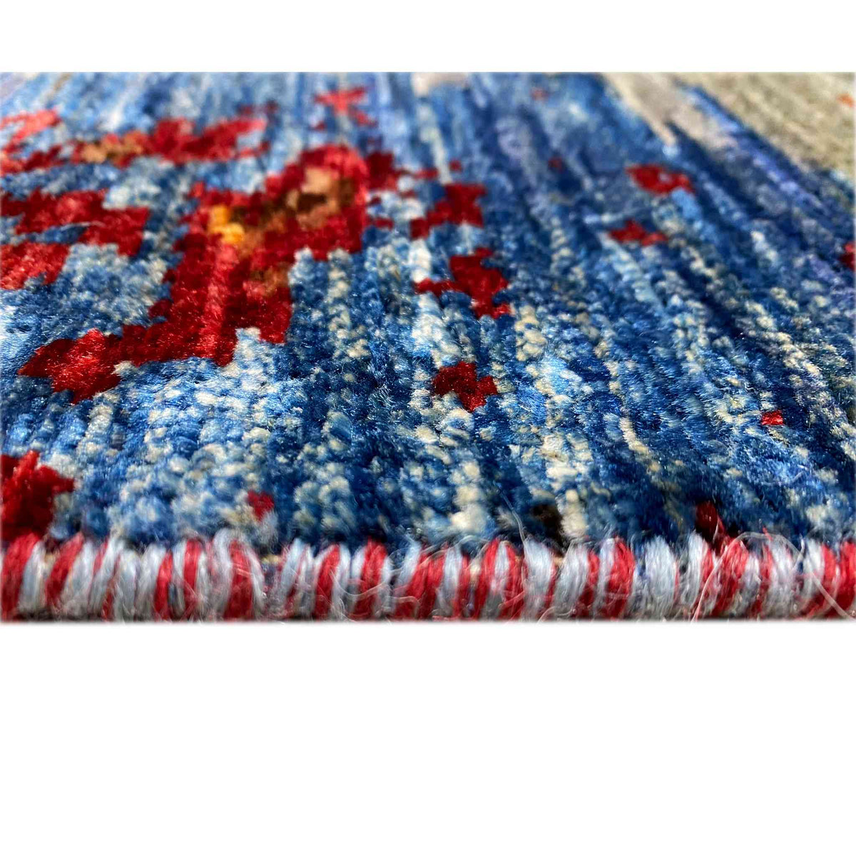 Mamluk carpet edge with multicolored pile structure and red/white fringes