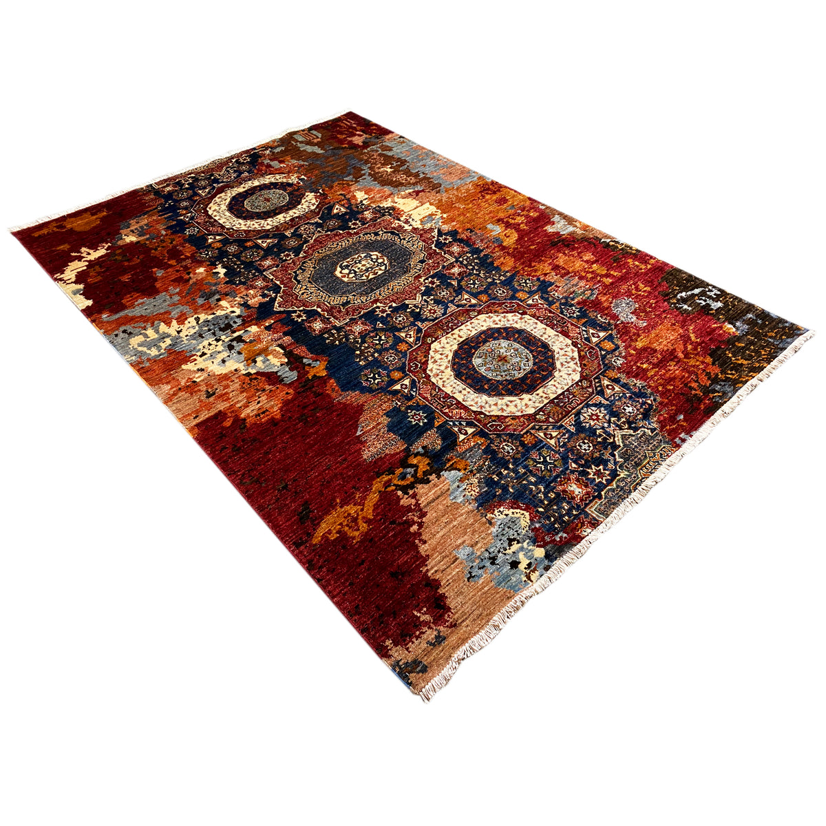 Hand-knotted Mamluk rug with a geometric medallion pattern in red, blue, and cream, diagonal.