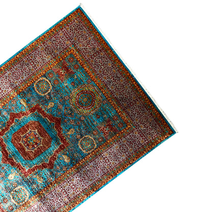 Hand-knotted rug, corner detail with framed border and central medallion