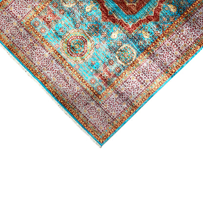 Hand-knotted rug, close-up of the corner with a turquoise border and ornaments