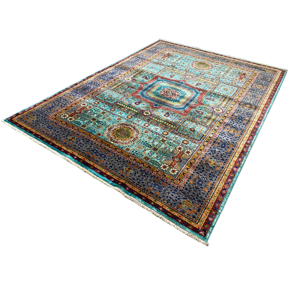Mamluk rug viewed from above at an angle, geometric patterns in turquoise, yellow, and dark gray