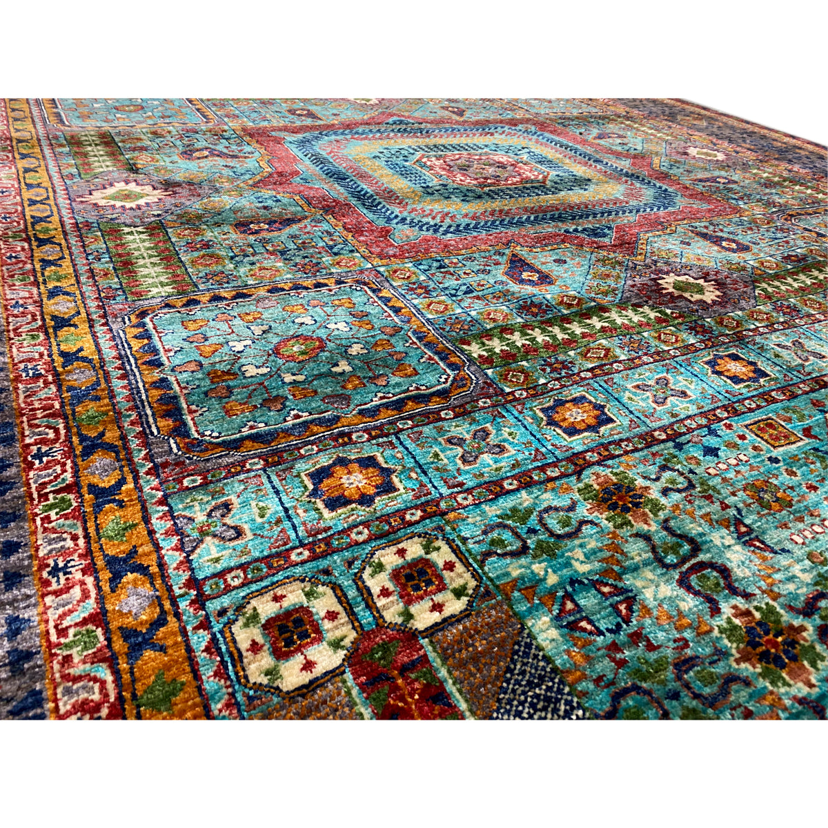Close-up of the Mamluk carpet: floral ornaments, turquoise fields, dense weave texture