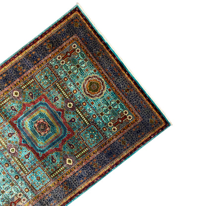Mamluk rug from an oblique perspective, dark gray background with turquoise patterns