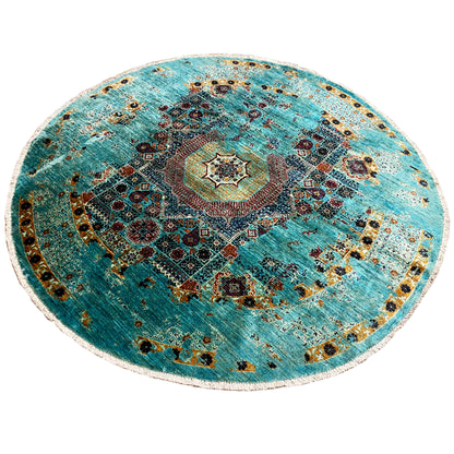 Round Mamluk rug with a turquoise background, central rosette, and colorful patterns