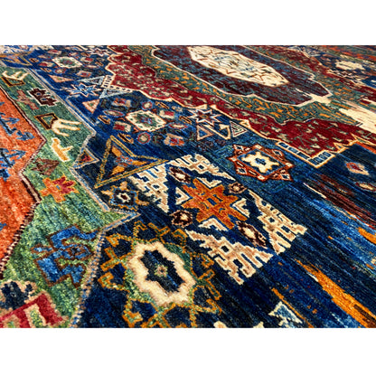 Mamluk rug detail view: blue, red, green, and beige ornaments with fine patterns.