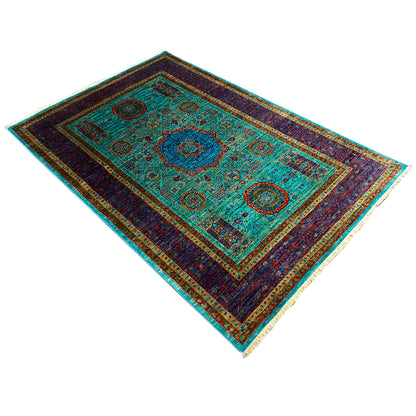 Mamluk rug in turquoise and dark blue with a central medallion and geometric motifs