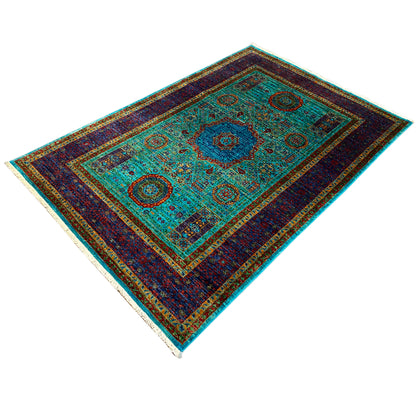 Mamluk carpet with a turquoise ground, dark blue border, and round ornamental medallions