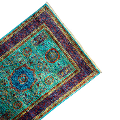 Mamluk carpet at an angle: turquoise field with a row of medallions and a dark blue border