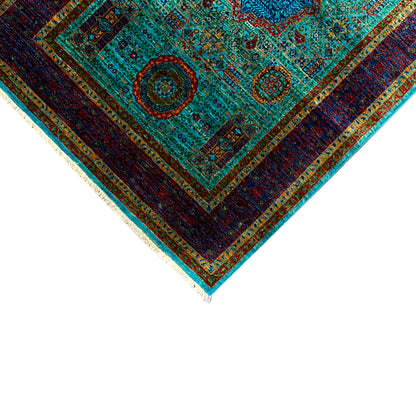 Rug corner with turquoise ornaments, dark blue edging, and multicolored fringe trim